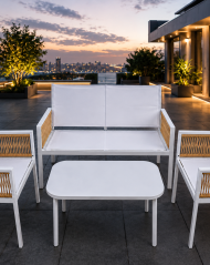 DOON modern white aluminum rattan patio furniture 4pcs conversation set on city rooftop terrace at sunset, outdoor balcony lounge sofa with coffee table